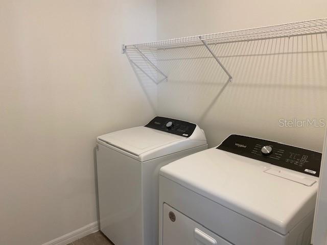 clothes washing area with washer and dryer