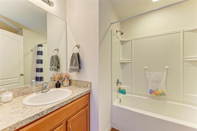 bathroom featuring shower / tub combo with curtain and vanity