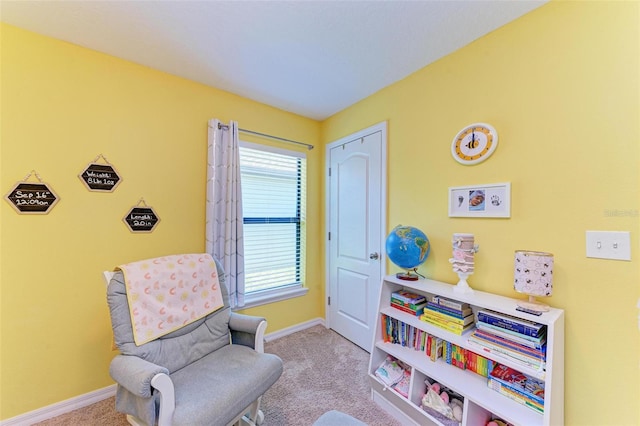 sitting room featuring plenty of natural light and light colored carpet