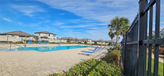 view of swimming pool with a patio