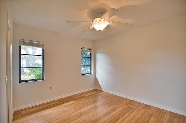 spare room featuring light wood-type flooring and ceiling fan