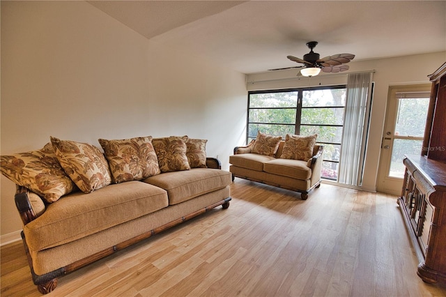 living room featuring ceiling fan and light wood-type flooring