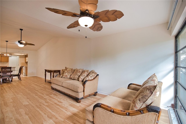 living room featuring lofted ceiling and light wood-type flooring