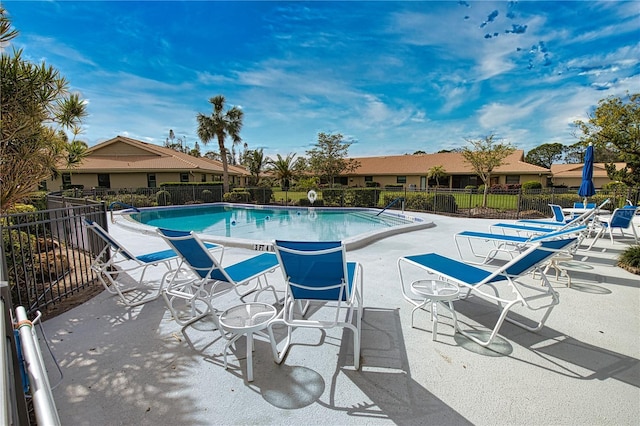 view of swimming pool with a patio