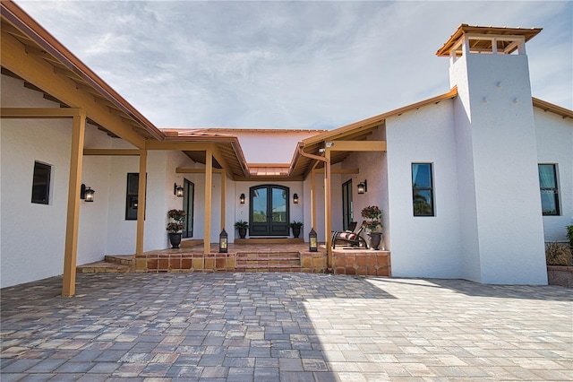 exterior space with french doors and a patio