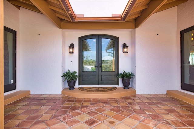 doorway to property featuring french doors and a patio