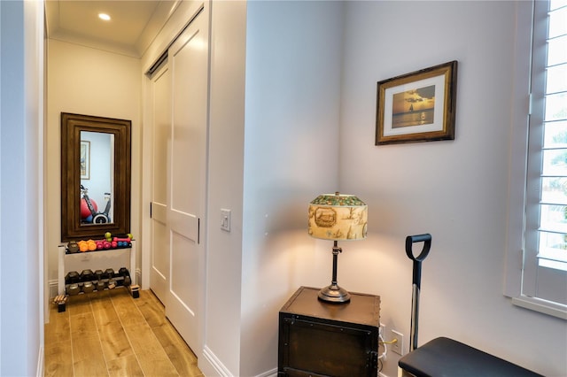 corridor with light hardwood / wood-style flooring