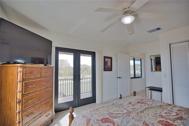 bedroom with access to exterior, french doors, and multiple windows