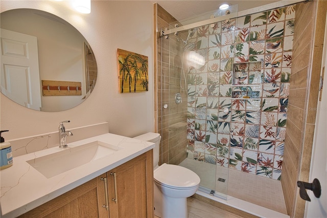 bathroom featuring hardwood / wood-style flooring, vanity, toilet, and an enclosed shower