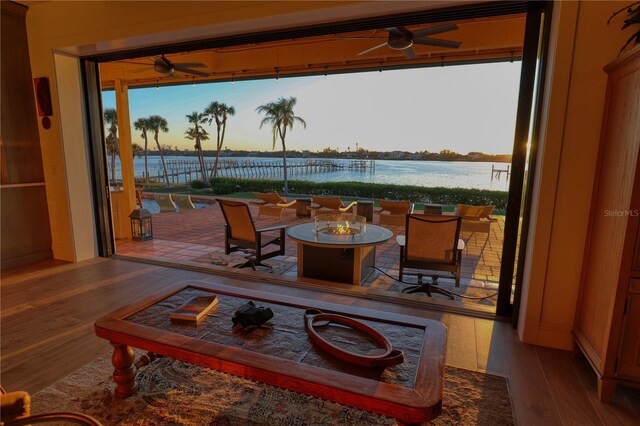 interior space featuring a water view and an outdoor fire pit