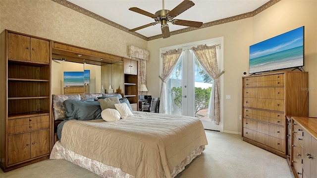 bedroom with light carpet, french doors, access to outside, and ceiling fan