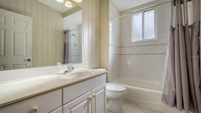 full bathroom featuring tile patterned flooring, vanity, shower / bath combo, and toilet