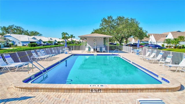 6713 Stone River Rd Unit 205, Bradenton, FL 34203 - community pool featuring a residential view and a patio