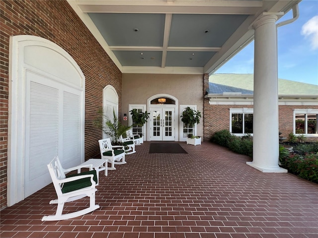 6713 Stone River Rd Unit 205, Bradenton, FL 34203 - view of patio featuring french doors