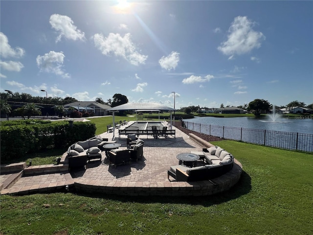 6713 Stone River Rd Unit 205, Bradenton, FL 34203 - view of patio featuring a water view and an outdoor living space
