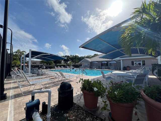 view of swimming pool featuring a patio area