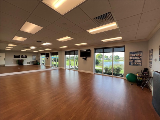 workout area with wood-type flooring