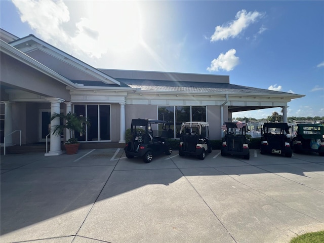 6713 Stone River Rd Unit 205, Bradenton, FL 34203 - back of property featuring stucco siding