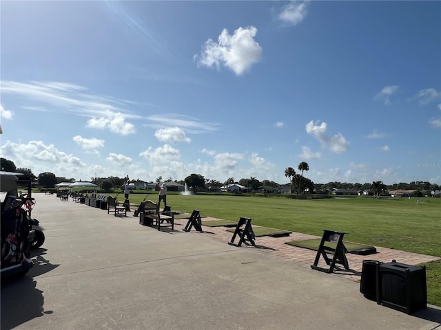 view of property's community featuring a lawn