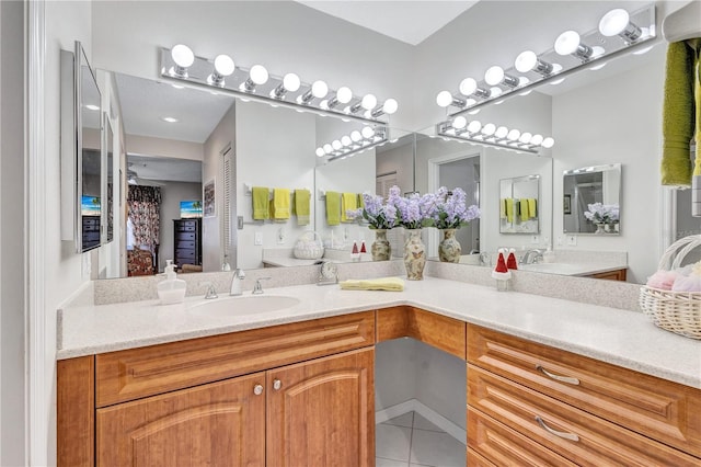 bathroom with tile patterned floors and vanity