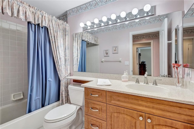 full bathroom with vanity, toilet, and shower / tub combo