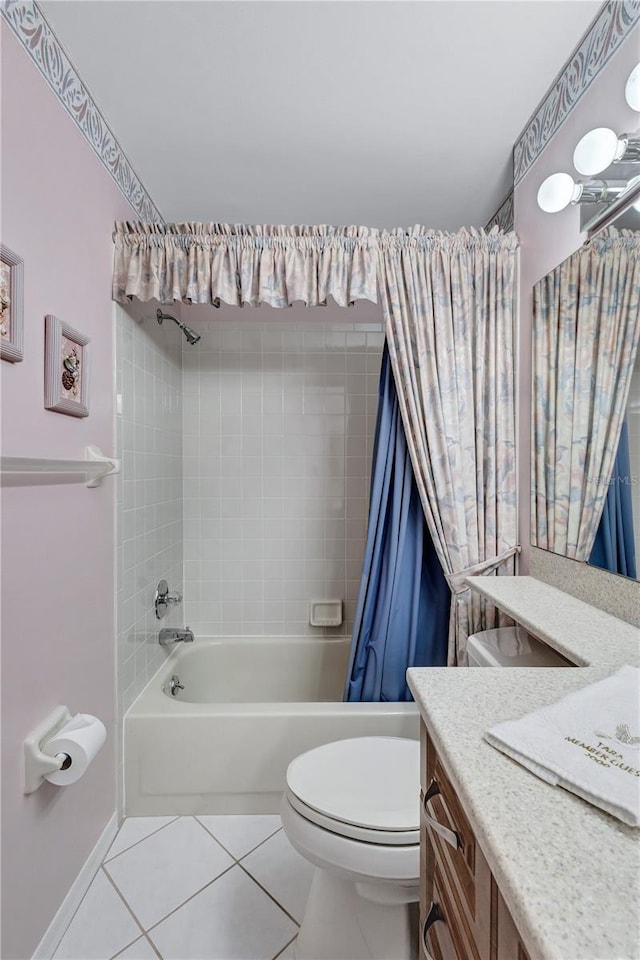 full bathroom featuring tile patterned flooring, vanity, toilet, and shower / tub combo