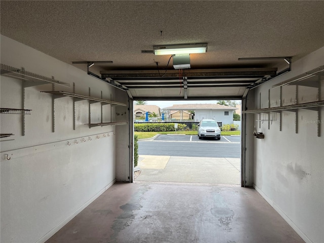 garage featuring baseboards