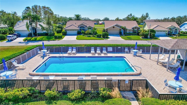 6713 Stone River Rd Unit 205, Bradenton, FL 34203 - community pool featuring a residential view and a patio area