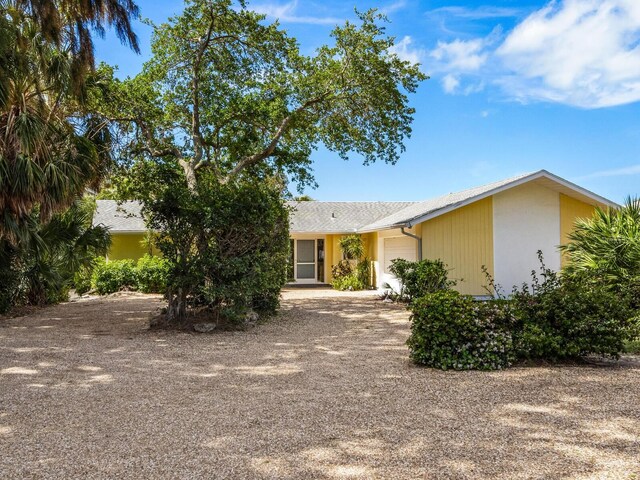 ranch-style home with a garage