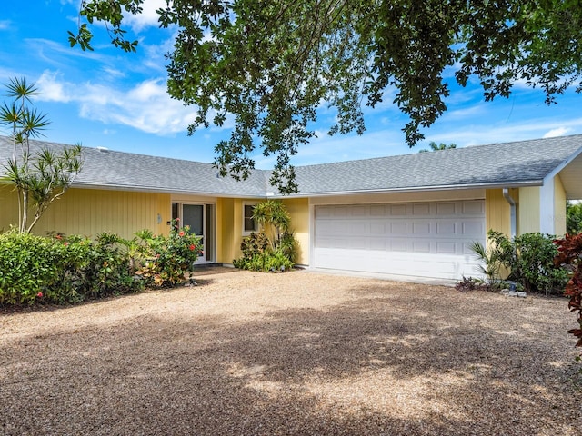 single story home featuring a garage