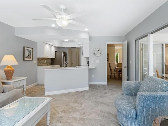 living room with ceiling fan