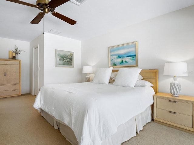 bedroom with ceiling fan and light colored carpet