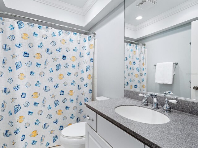 bathroom featuring curtained shower, toilet, vanity, and ornamental molding