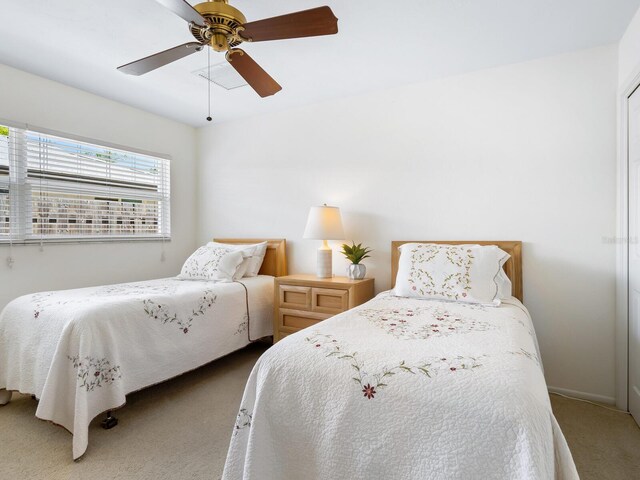 carpeted bedroom featuring ceiling fan