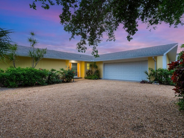 ranch-style home with a garage