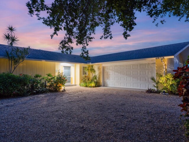 ranch-style house featuring a garage