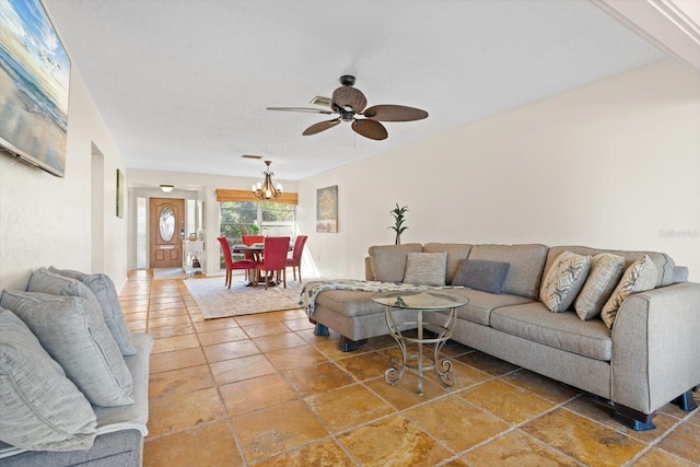 living room with ceiling fan with notable chandelier