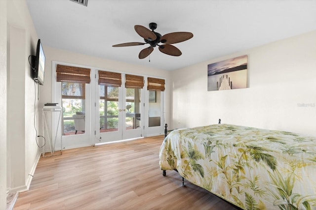 bedroom featuring ceiling fan, light wood-type flooring, and access to outside