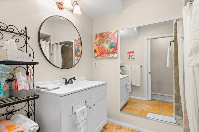 bathroom featuring vanity and curtained shower