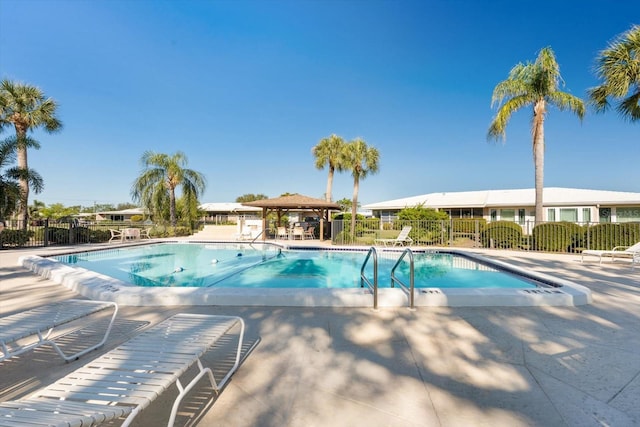 view of swimming pool with a patio area