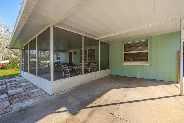 view of patio with a sunroom