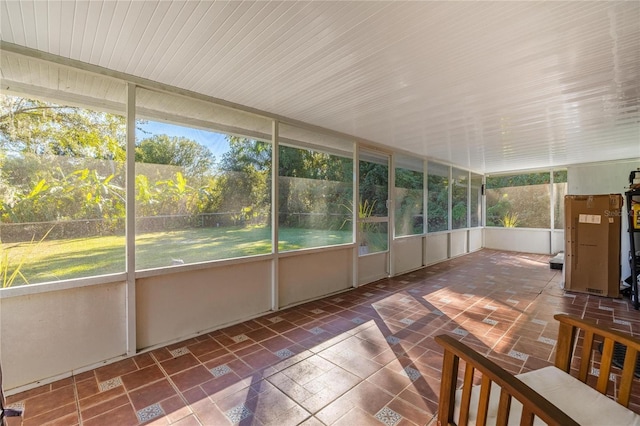 unfurnished sunroom featuring a healthy amount of sunlight