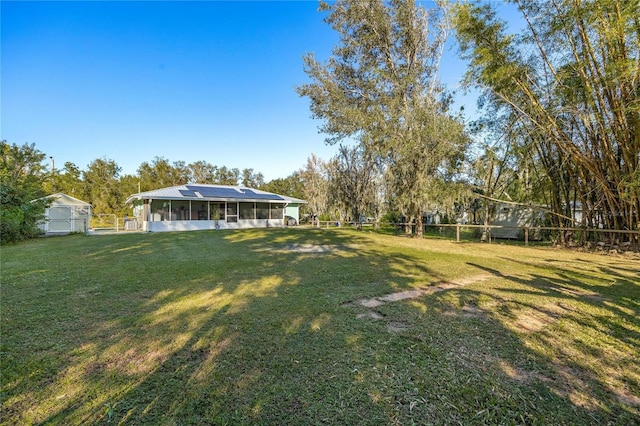 view of yard featuring a sunroom