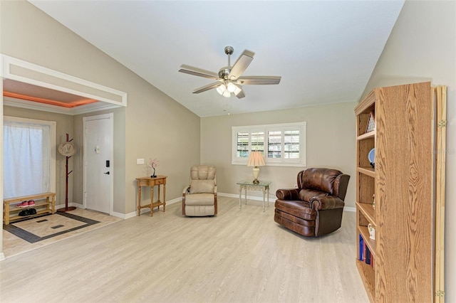 sitting room with ceiling fan, wood-type flooring, and lofted ceiling