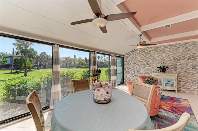 sunroom / solarium featuring lofted ceiling