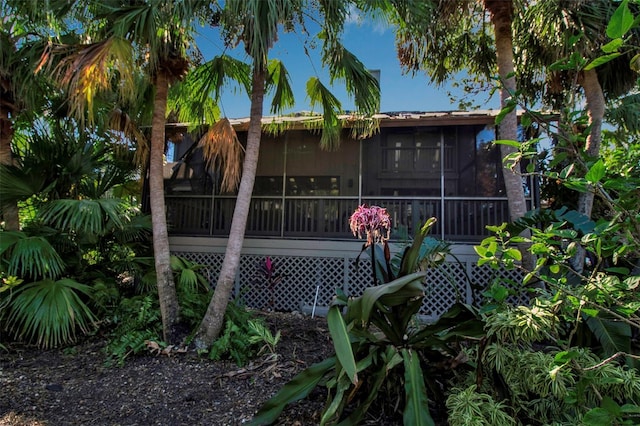 back of house featuring a sunroom