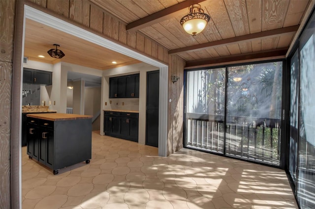 sunroom / solarium featuring beamed ceiling and wooden ceiling