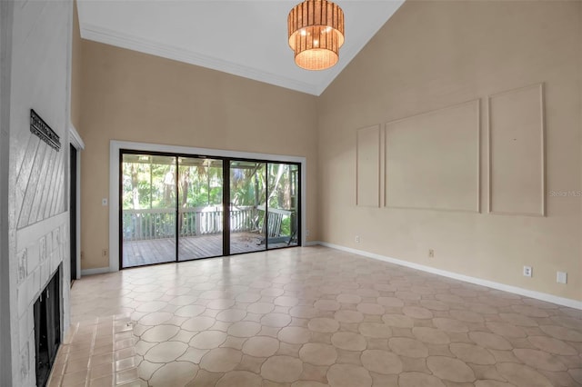 unfurnished living room with crown molding, high vaulted ceiling, and a chandelier