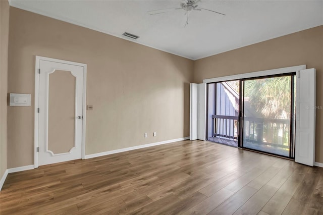 spare room featuring ceiling fan and wood-type flooring