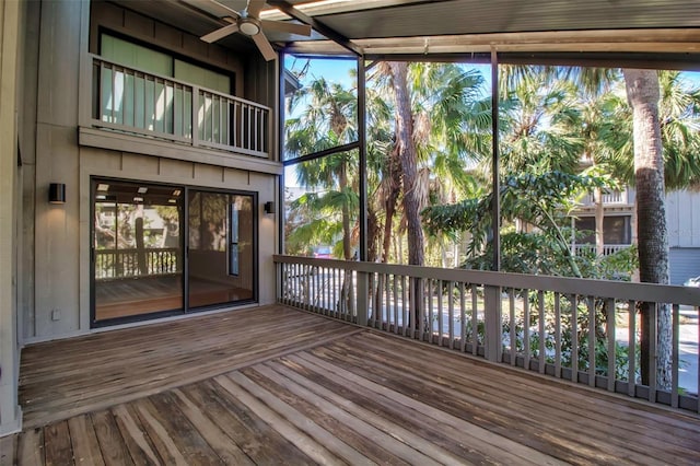 wooden terrace featuring ceiling fan